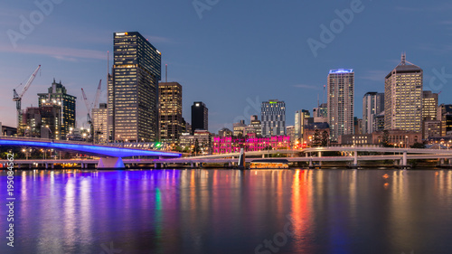 Brisbane CBD with skyscrapers reflecting in Brisbane river at night, Australia photo