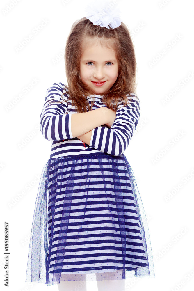 Cute little girl posing in front of the camera.