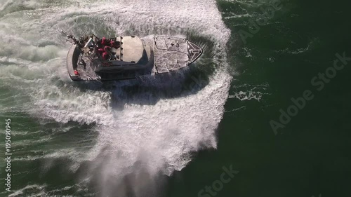 looking down epic wave over coast guard, rough seas, rouge wave crashing over boat water, Drone aerial video, 4k, rescue, marine, pacific, tide, surge, danger, dangerous waves raw
