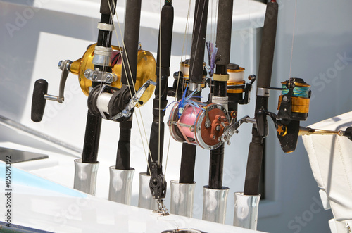 Closeup of a variety of fishing reel non a charter fishing boat