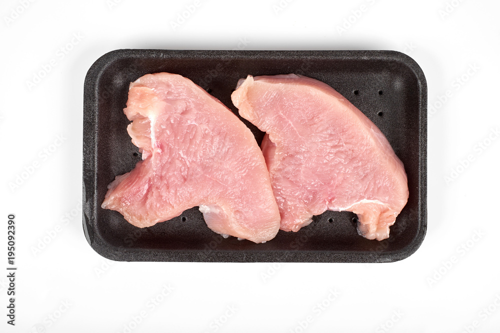 Raw dietary turkey meat in tray, isolated on white background Raw dietary turkey meat in tray, isolated on white background