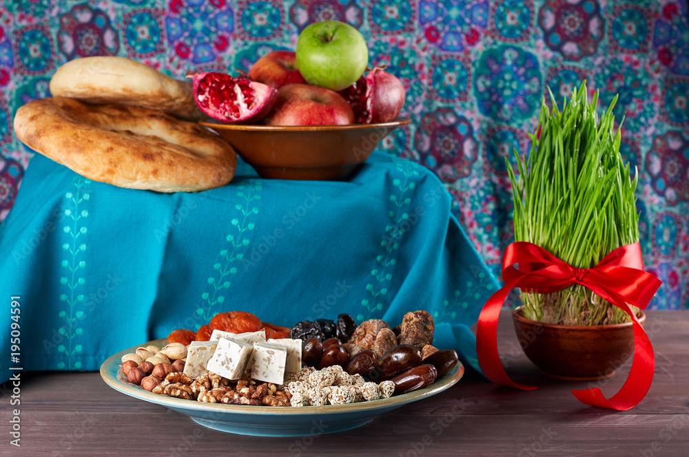 Traditional Azerbaijan sweet cuisine of holiday Nowruz. Fresh green grass samani symbol of spring