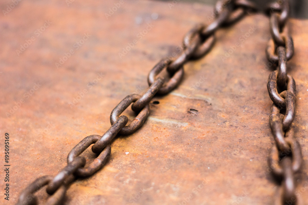 rusty chain on wooden background rusty chain on wooden background
