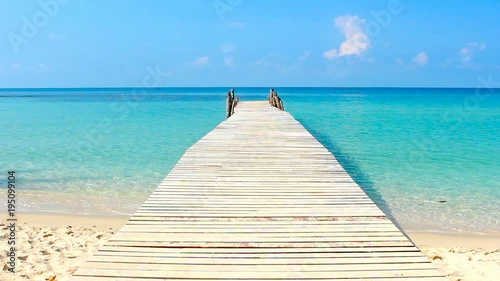 wooden walkway in the sea on tropical beach thailand