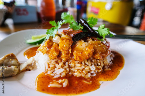 Rice crispy pork with Dry chili and Coriander in white plate