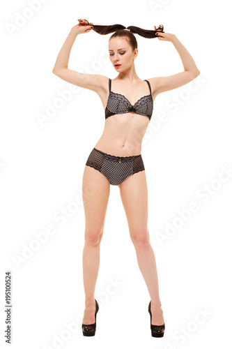Beautiful girl in lingerie holding her hair in her hands