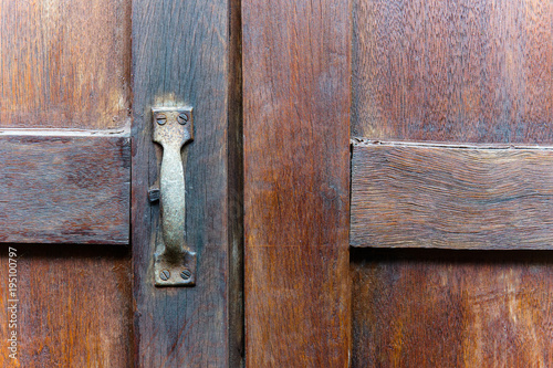 Closed up of rustic handle on the wooden windows. Background image.