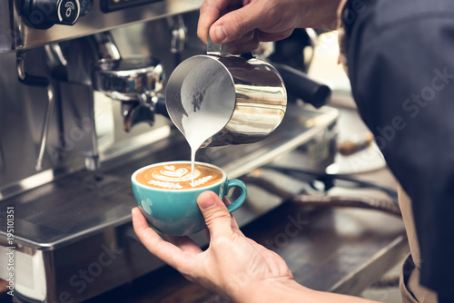 Quadro em tela Barista making Rosetta shape latte art coffee