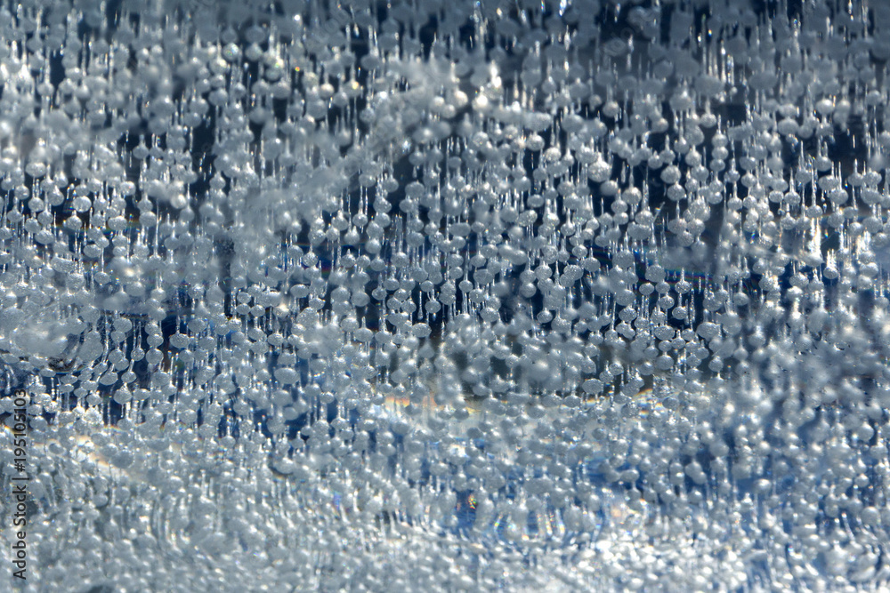 Abstract background. Bubbles of air frozen in ice. Fabulous texture.