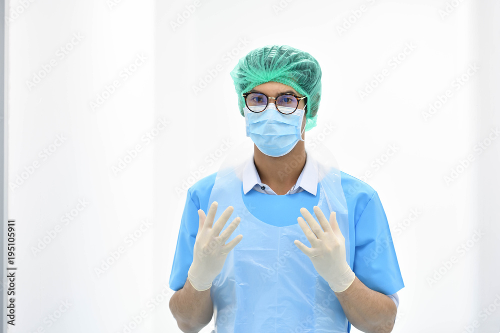 Asian male obstetrician with mask ready for operation in hospital Asian male obstetrician with mask ready for operation in hospital