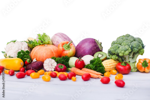 Fresh vegetables on wooden table. Isolated.