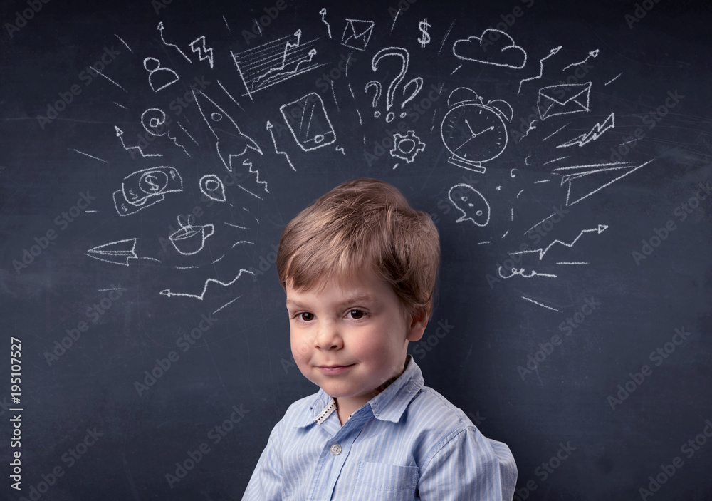 Little boy in front of a drawn up blackboard Little boy in front of a drawn up blackboard