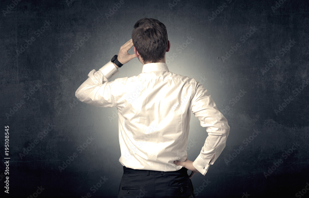 Businessman standing and thinking