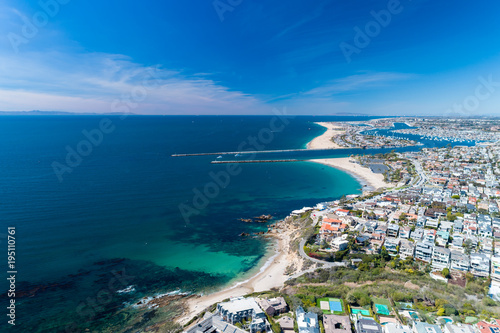 Aerial view of coastal Newport Beach in Orange County, California, USA with coast, sand and blue skies. photo