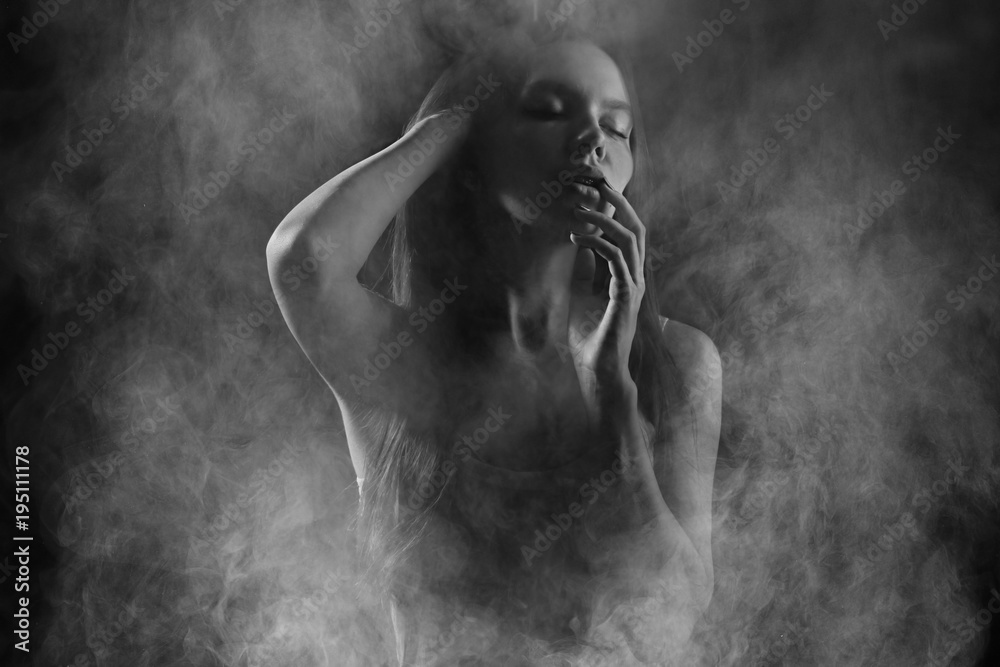 Portrait of a sexy girl with smoke - obrazy, fototapety, plakaty 