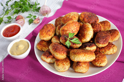 fried hot meat cutlets on a white plate