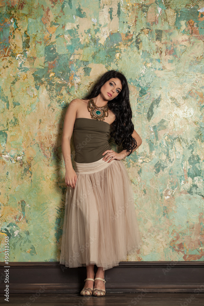 Beautiful Young Brunette Woman in Nice Clothes and High Heels Sandals. Fashion Photo Beautiful Young Brunette Woman in Nice Clothes and High Heels Sandals. Fashion Photo