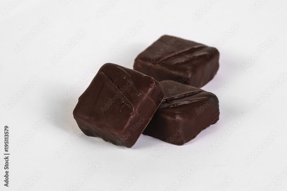 Handmade chocolate candy with filling isolated on white Handmade chocolate candy with filling isolated on white