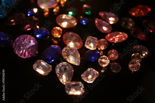 Colorful precious stones for jewellery on dark background © Africa Studio