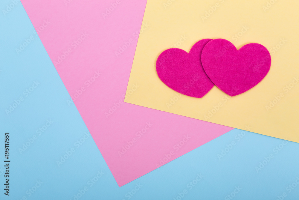 Heart shapes on serenity colored paper texture