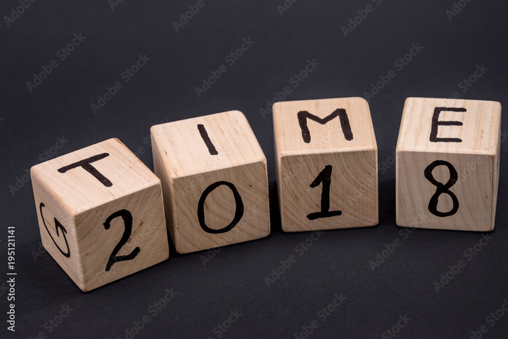Wooden bricks with word TIME, isolated on black Wooden bricks with word TIME, isolated on black