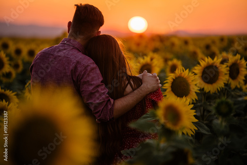 Photography Couple looking at the sunset