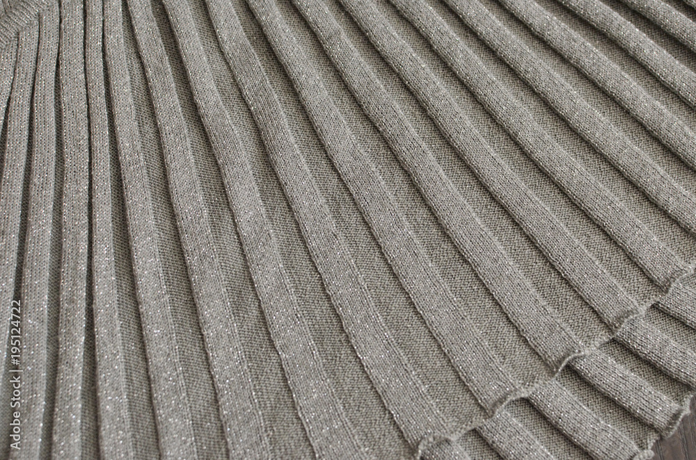Background grey texture of beige pattern knitted fabric made of cotton or wool closeup Background grey texture of beige pattern knitted fabric made of cotton or wool closeup