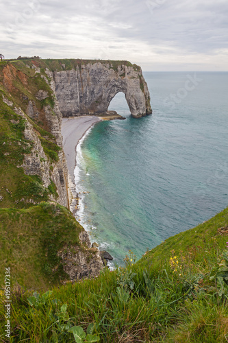 Famous chalk cliffs and natural arches located on the coast of the Pays de Caux area at Etretat, Normandy, France
