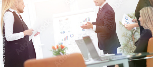 businessman makes a presentation to his business team