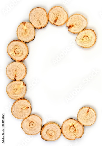 Alphabet letters made from Wood slice on white Background.C.