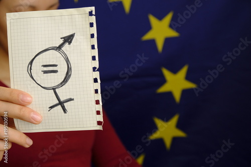 equals sign and a male symbol drawn on a piece of paper depicting the women sexual equality. gender equality drawn in it. fairness of treatment for women and men in the EU photo