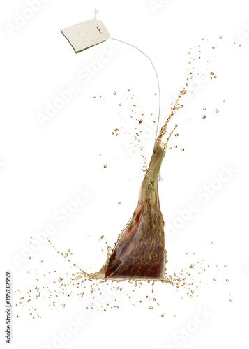 Tablou pe pânză wet tea bag fliyng and dripping on white background