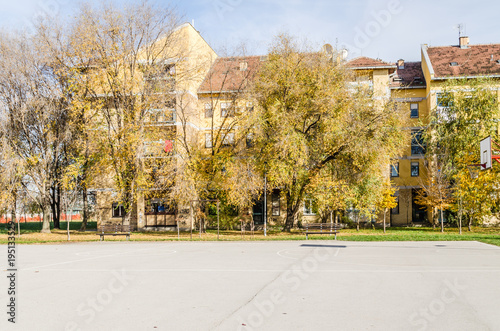 Open basketball court in front of the building 