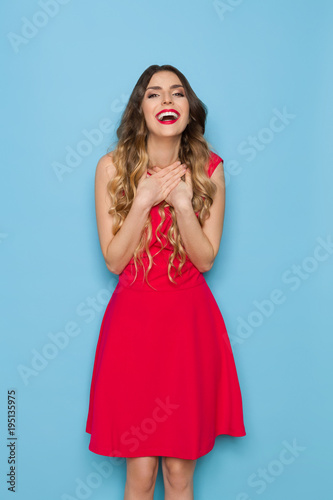 Laughing Elegant Woman Is Holding Hands On Chest
