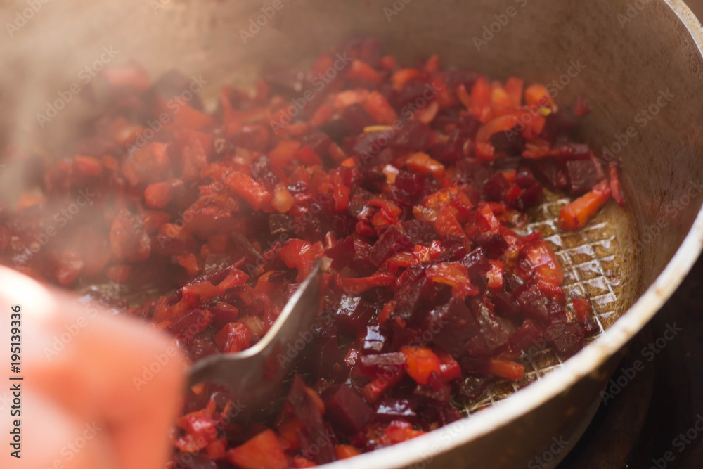 Fried beet slices on a cast-iron frying pan. Fried beet slices on a cast-iron frying pan.