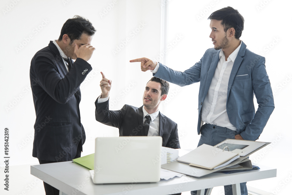 Business team point people mistake of work.Seriously discussing work as a team in the office. Business team point people mistake of work.Seriously discussing work as a team in the office.