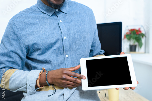 African american man showing digital tablet screen