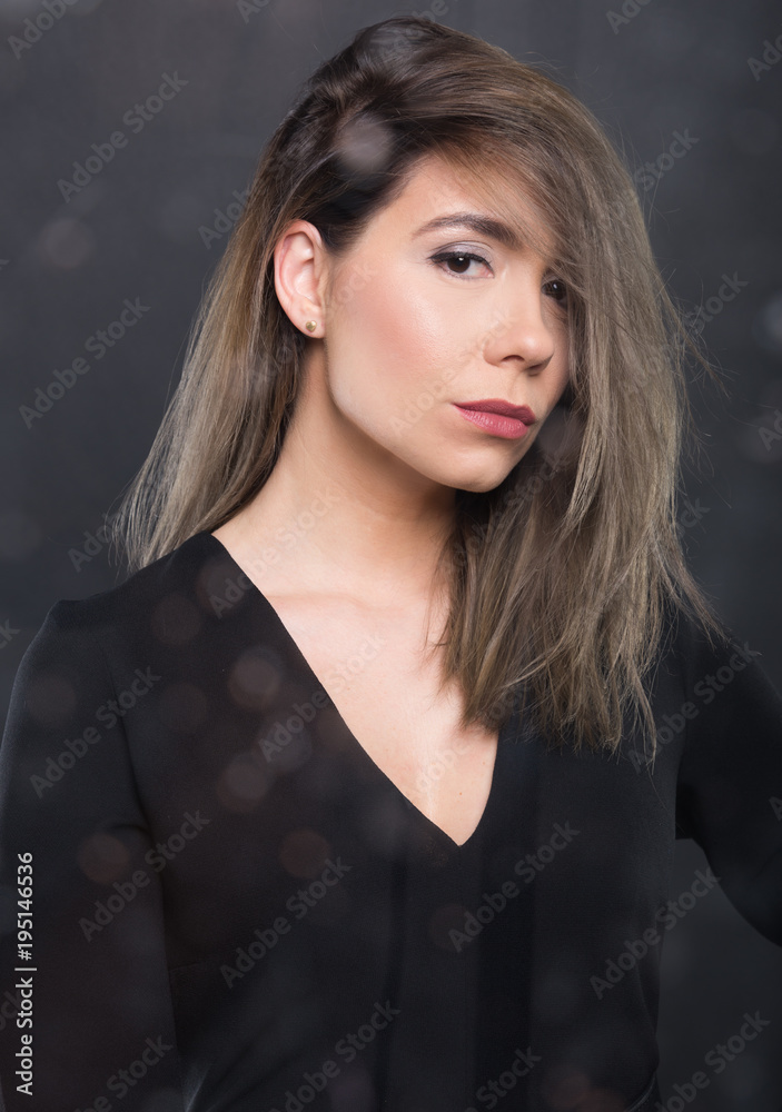 Portrait of beautiful model posing wearing black blouse. Portrait of beautiful model posing wearing black blouse.