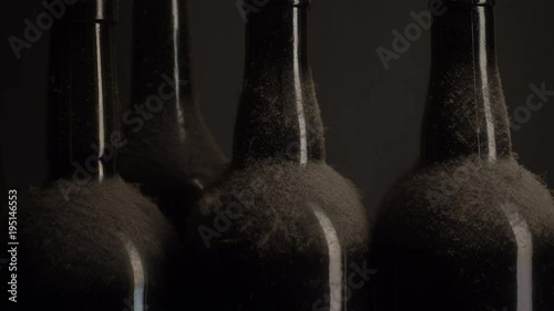 Old wine bottles close-up. Moving light