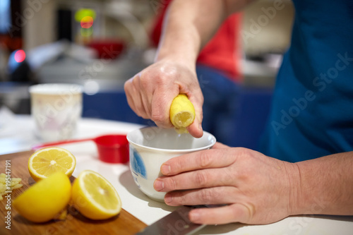 Hand squeezing lemon