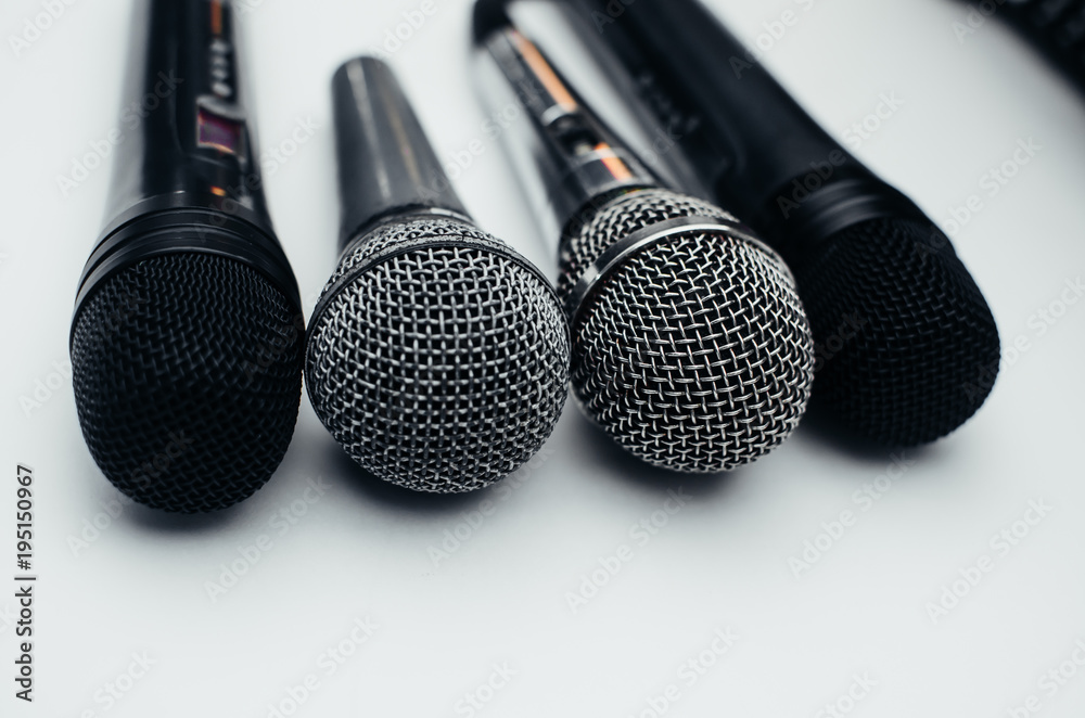 Obraz premium Microphone on white background, black, silver, different