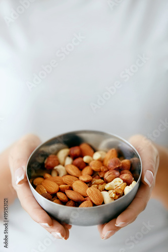 Healthy Food. Hands Holding Bowl With Nuts