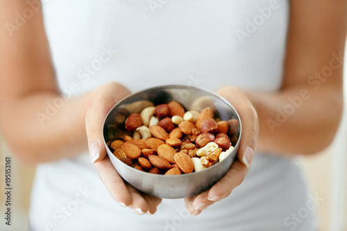 Healthy Food. Hands Holding Bowl With Nuts