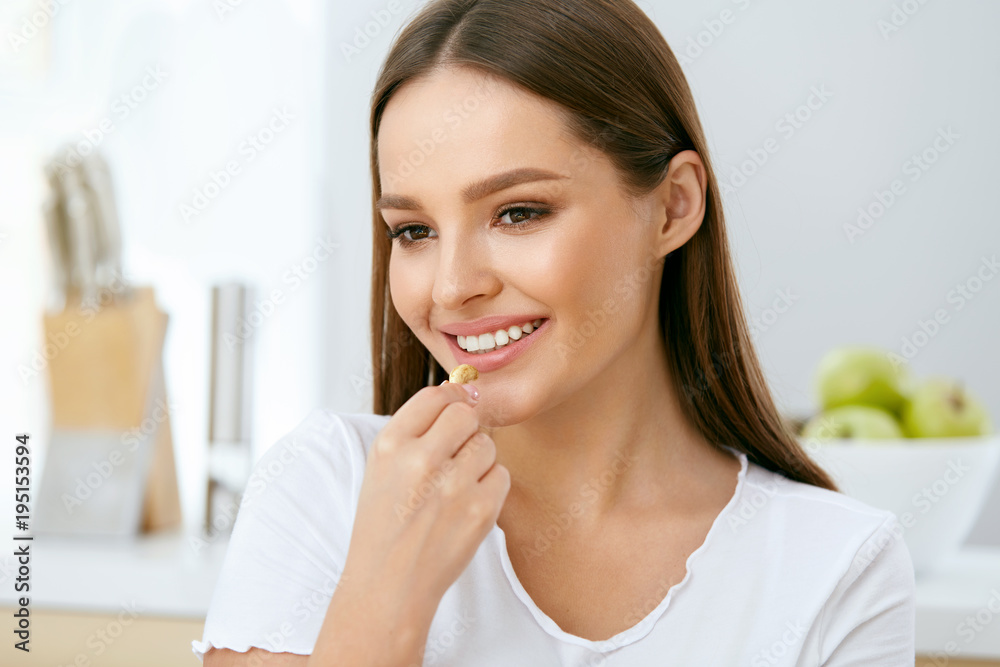 Woman Eating Healthy Diet Food In Kitchen