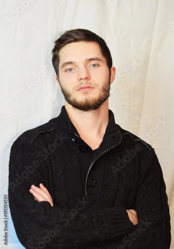 east asian handsome man wearing black tshirt and jeans