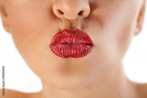 gorgeous red lips pucker up for kiss