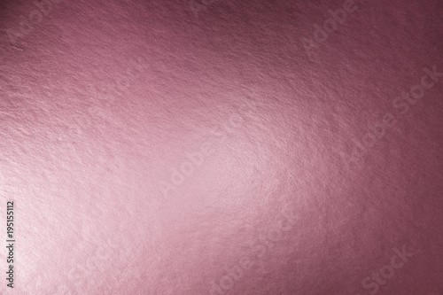 Texture of pink metallic foil paper background for design Christmas or New Year's or party cards