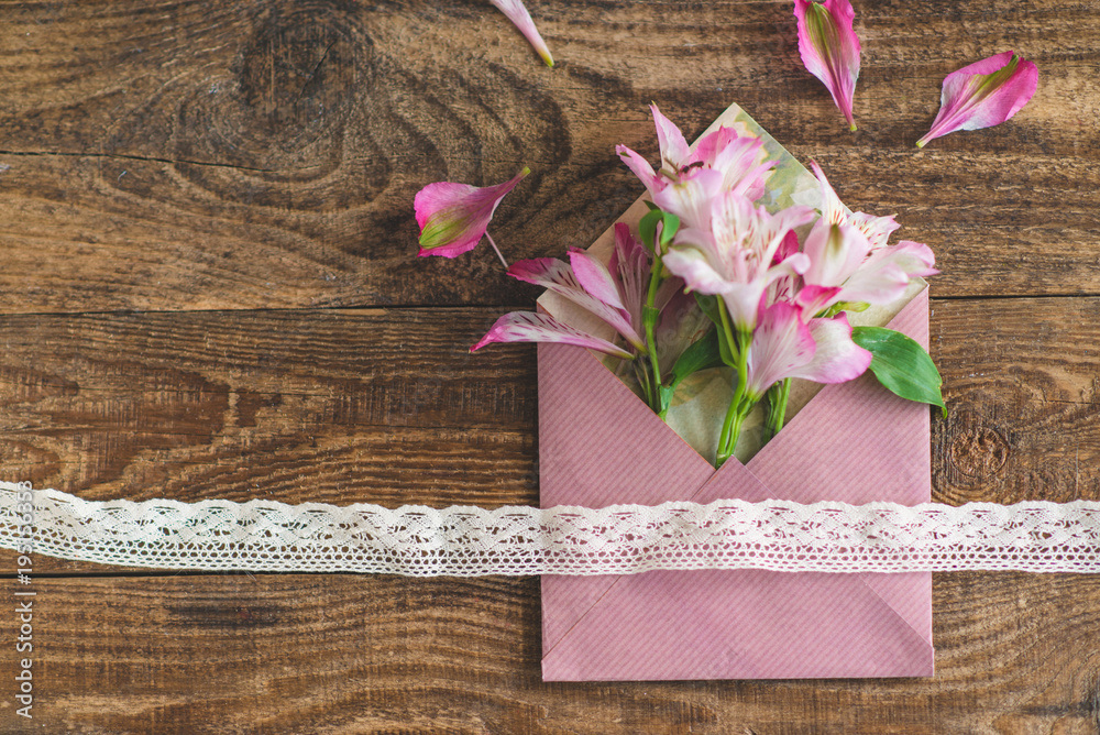 a bouquet of flowers is in an envelope