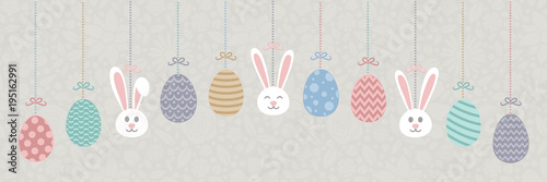 Pastel coloured Easter banner with hanging bunnnies and decorative eggs. Vector.