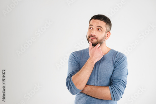 Thoughtful man isolated over white background